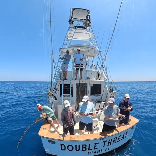 Action aboard the Double Threat on a Miami fishing charter