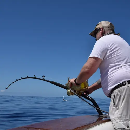 Action aboard the Double Threat on a Miami fishing charter