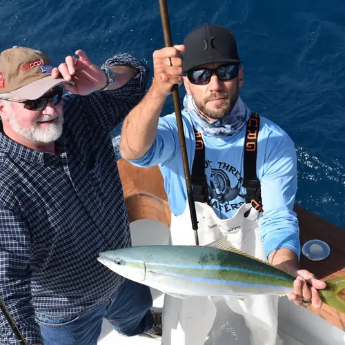 A Rainbow Runner caught aboard the Double Threat on a Miami fishing charter