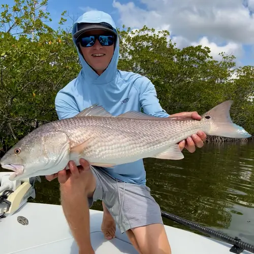 A Redfish caught aboard the Double Threat on a Miami fishing charter