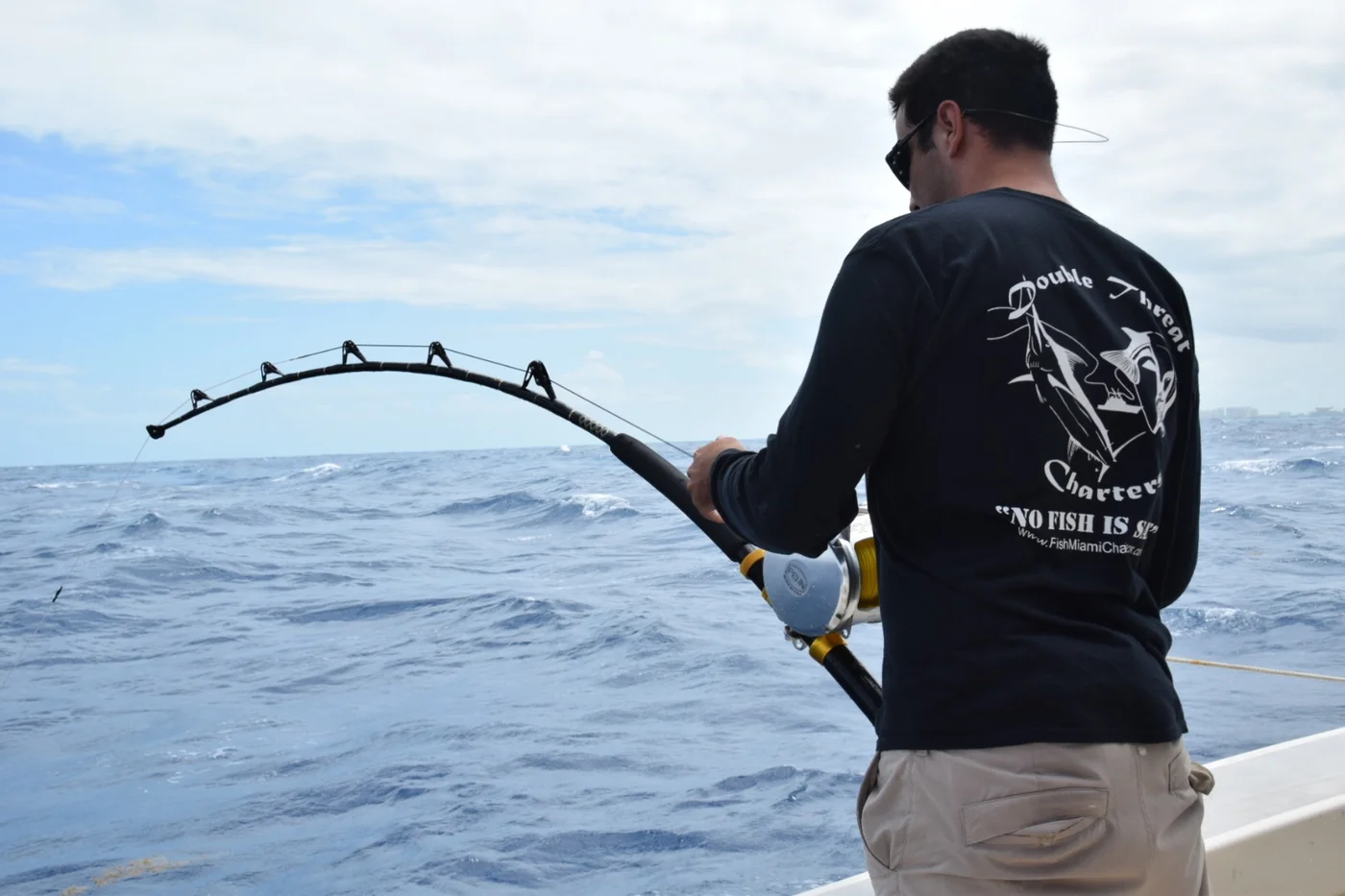 Angler bent into a bluefin tuna on a 130-class rod off Miami
