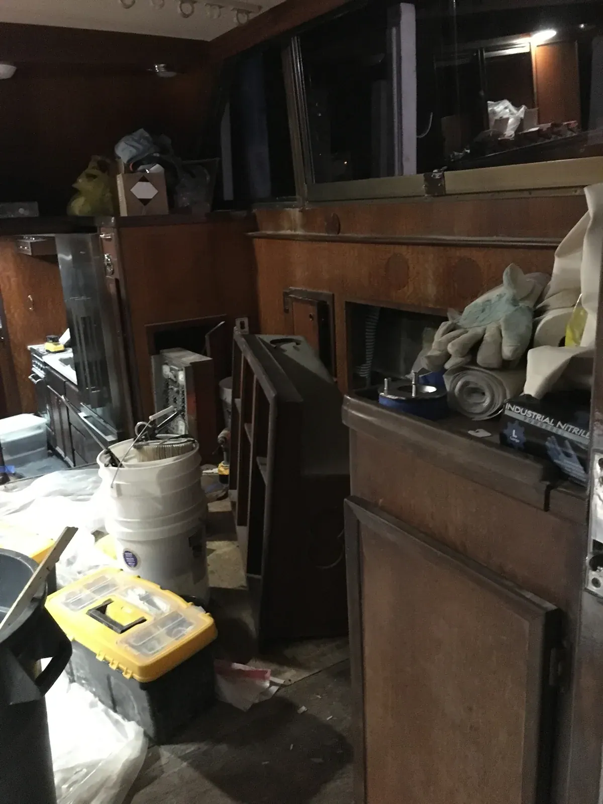 The gutted interior at night, old teak cabinetry torn out