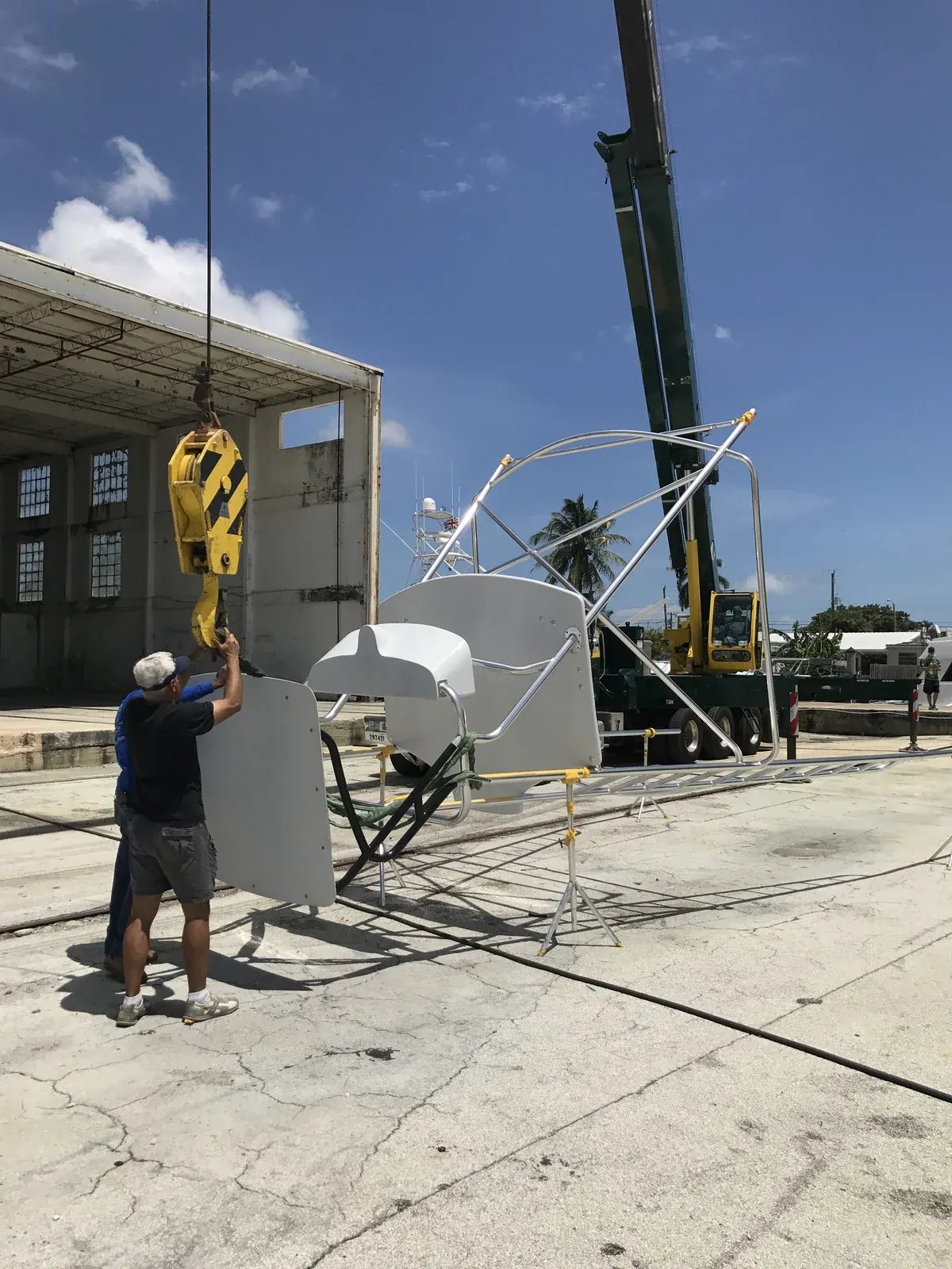 Prepping the hardtop on tower-install day with the crane staged