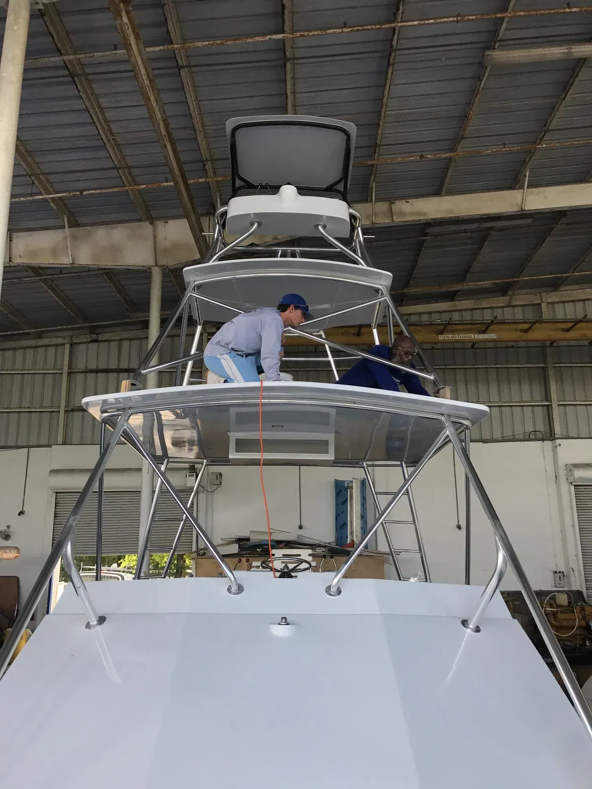Rigging the second helm in the tower after the hardtop went on