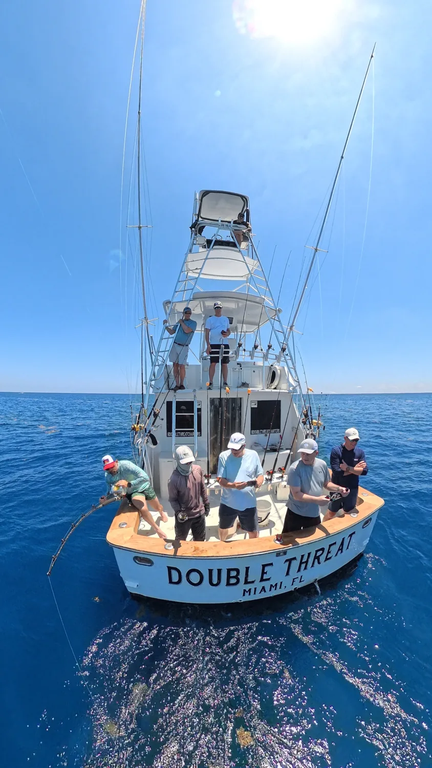 The Double Threat fishing offshore Miami with the crew on deck