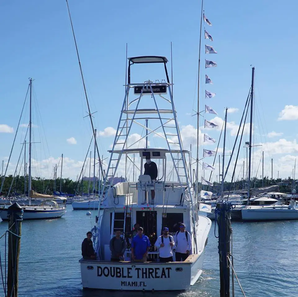 The Double Threat returning to the dock with release flags flying after a double digit sailfish day