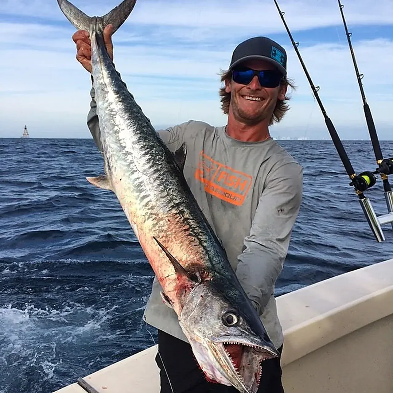 An angler holding a big king mackerel caught off Miami