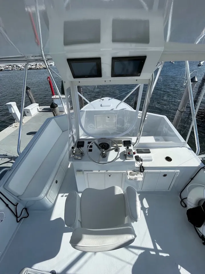 The Double Threat's flybridge with hardtop, fresh upholstery, and full Garmin and SMX electronics suite